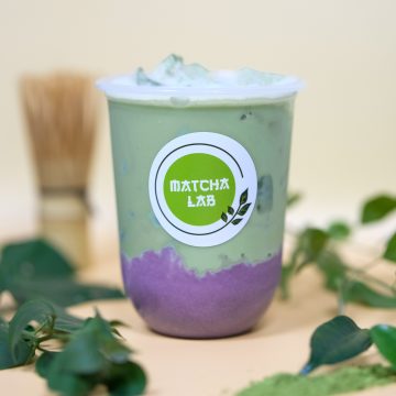 Taro foam matcha latte beverage at cafe